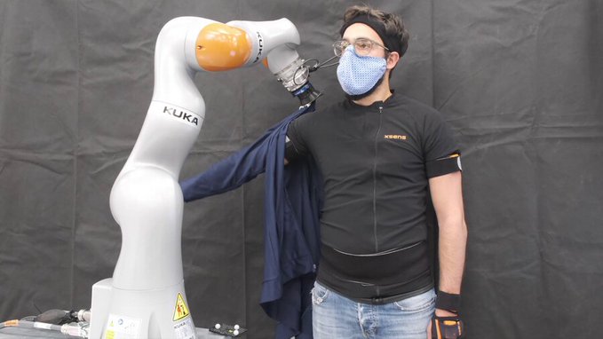 Robots dress humans without the full picture