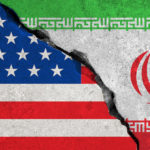 iranian flag on broken wall and half usa united states of america flag