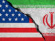 iranian flag on broken wall and half usa united states of america flag